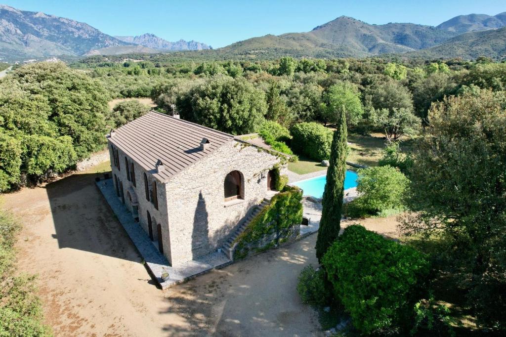 an aerial view of a house with a swimming pool at Chambres de charme in Corte