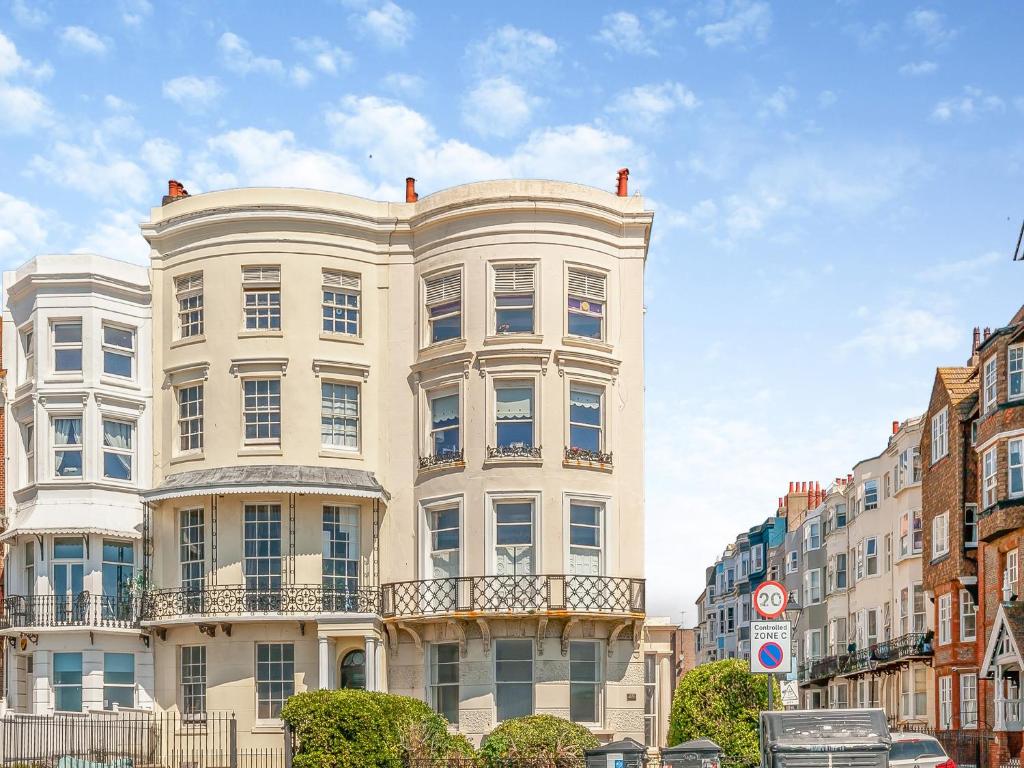 a tall white building on a city street at The Beach Studio in Brighton & Hove