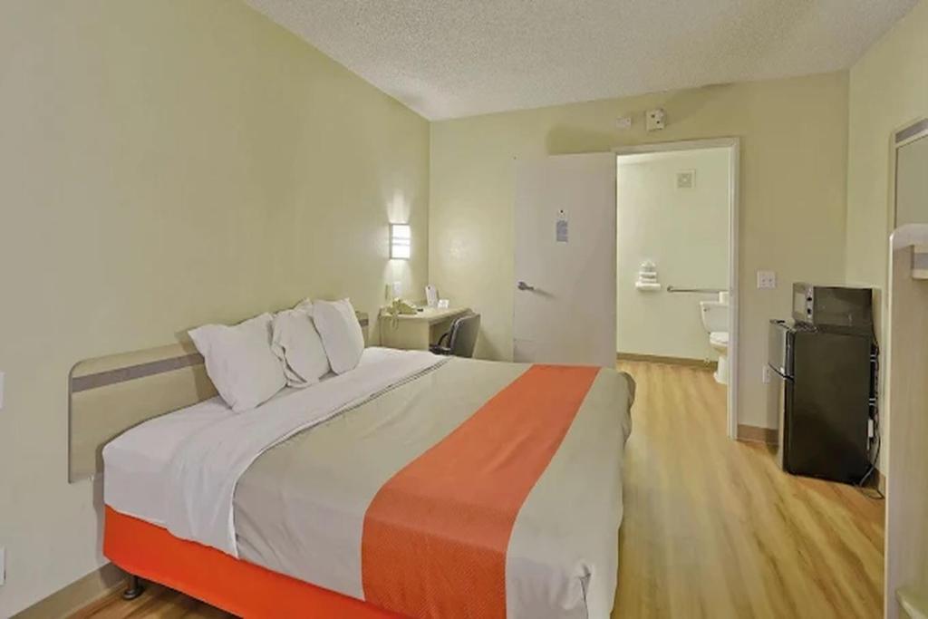 a bedroom with a large bed in a room at Value Extended Stay in Maple Shade