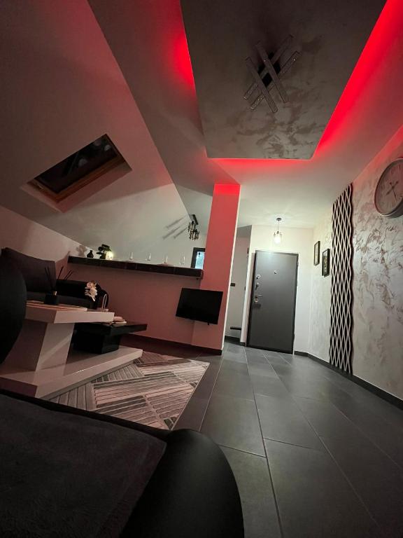 a living room with red lights on the ceiling at Crassula Lux 4 in Surčin
