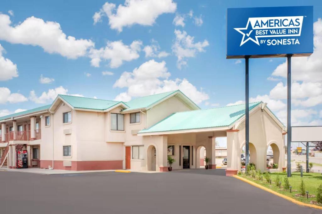 a sign in front of a motel at Americas Best Value Inn Hobbs in Hobbs