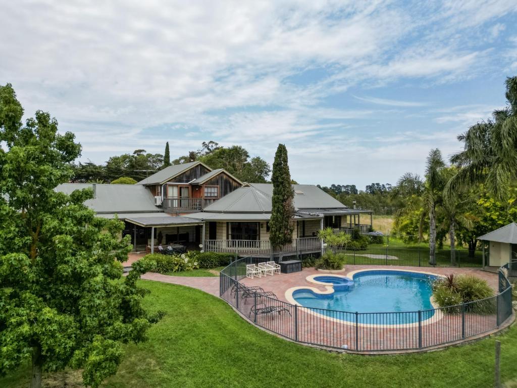 an aerial view of a house with a swimming pool at The George at Yering in Yering