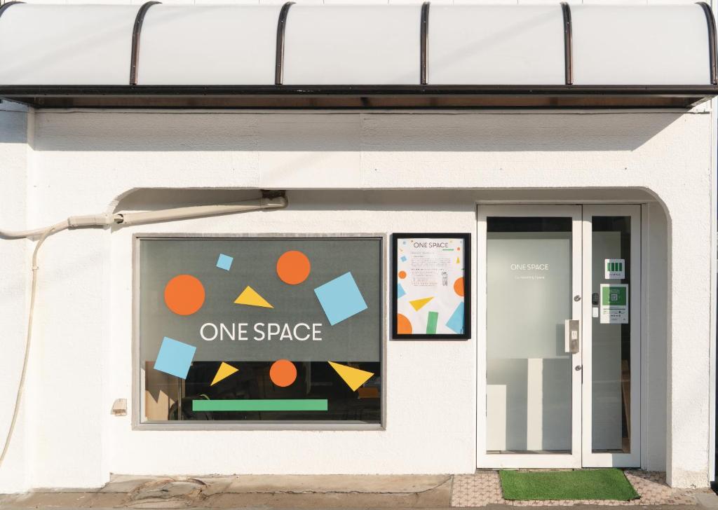 a building with a one space sign in the window at one space 泊まれるコワーキングスペース in Kawatana