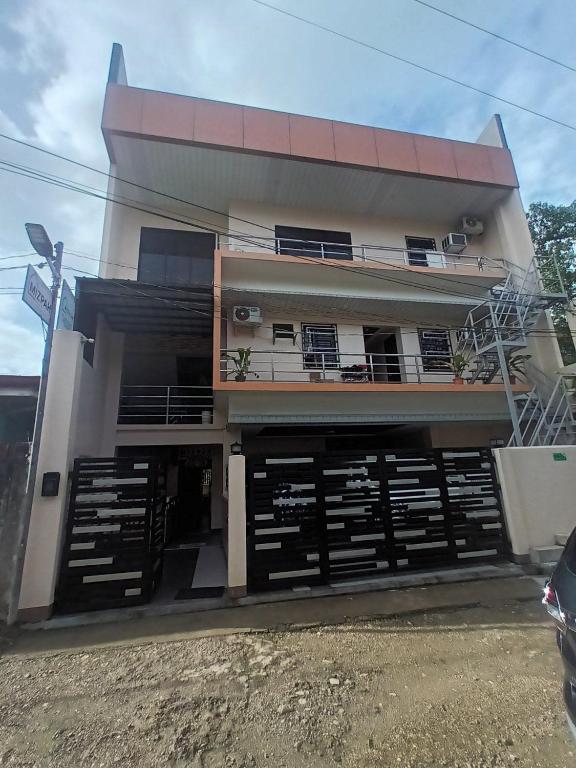 a building with a lot of doors in front of it at Mizpah Apartelle in Tagbilaran City
