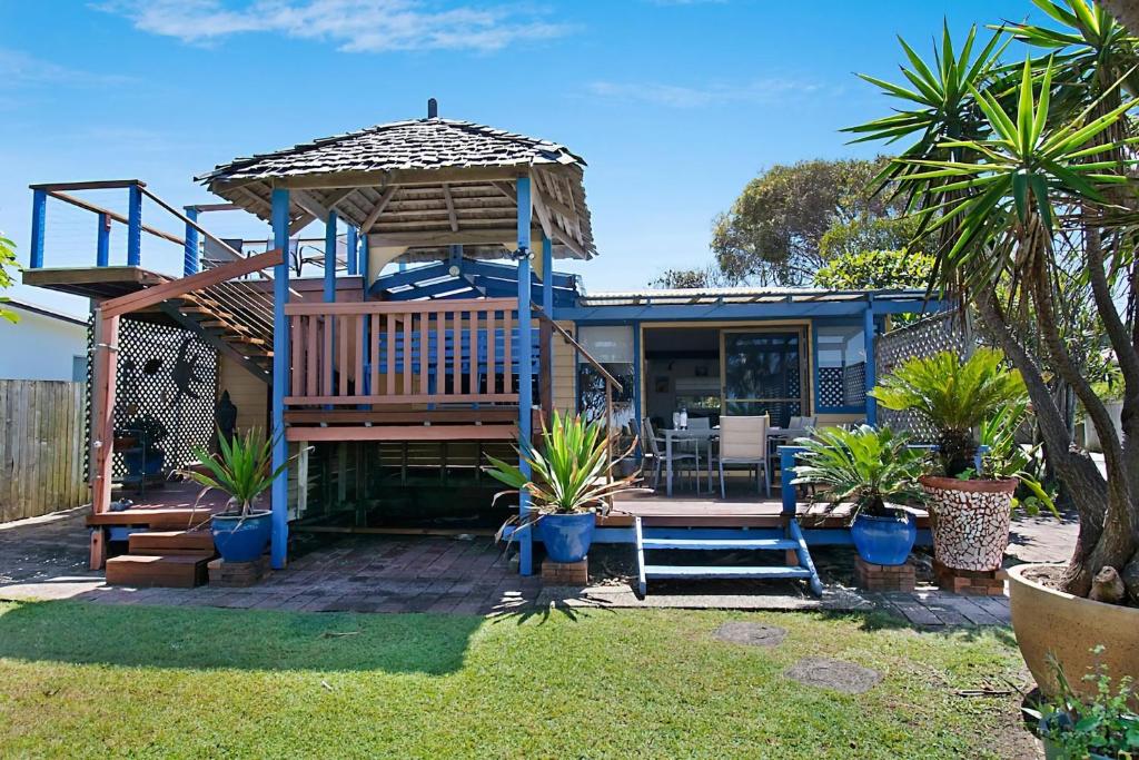 a house with a deck and a gazebo at Beach House in Lennox Head