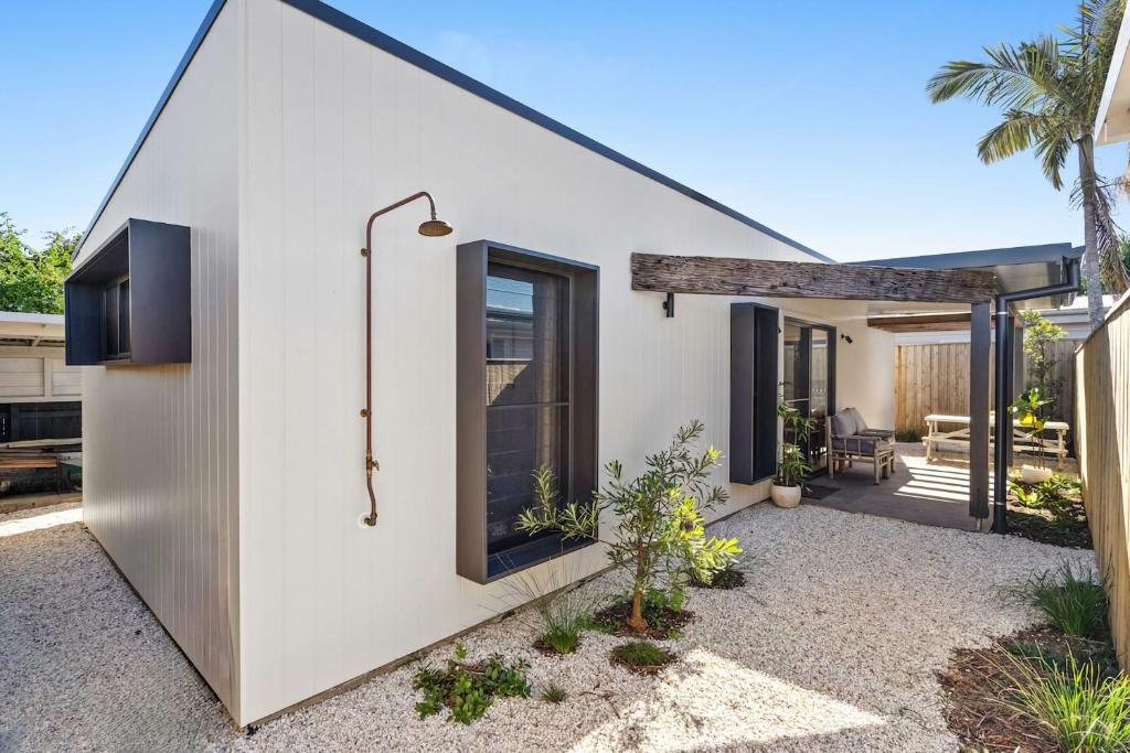 a house with a large window and a patio at Blue Ash Studio in Lennox Head