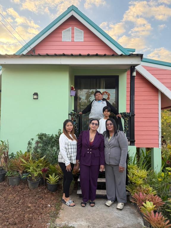 a group of women standing in front of a house at ภูร่องลม ฟาร์ม in Phetchabun