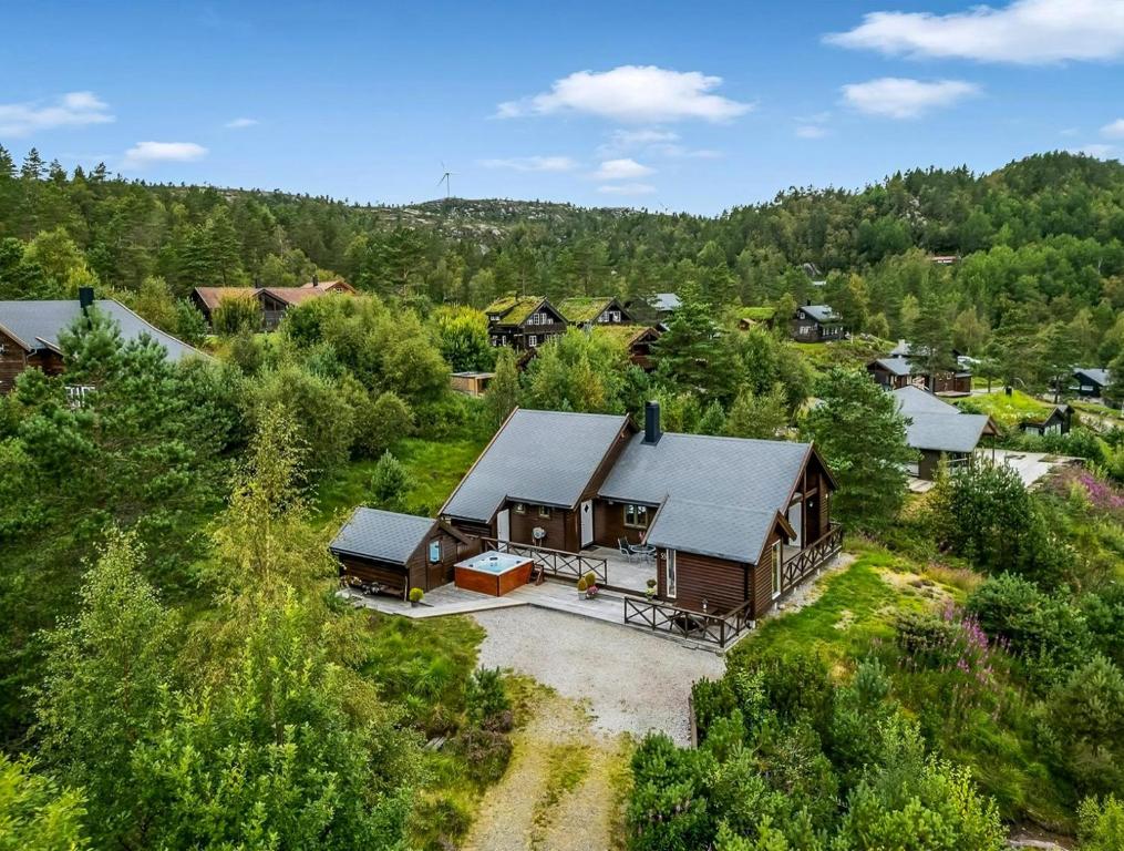 an aerial view of a house in a forest at Cabin With Jacuzzi And Stream In Krågeland in Kvinlog