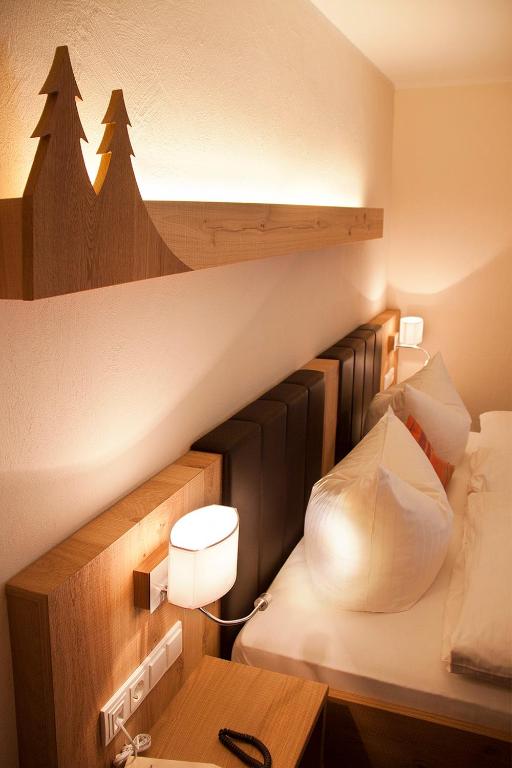Postel nebo postele na pokoji v ubytování Hotel Gut Vorwald