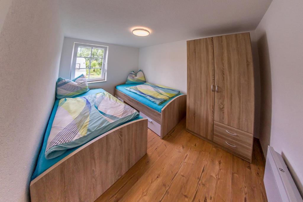 Postel nebo postele na pokoji v ubytování Campingplatz am Hünstein