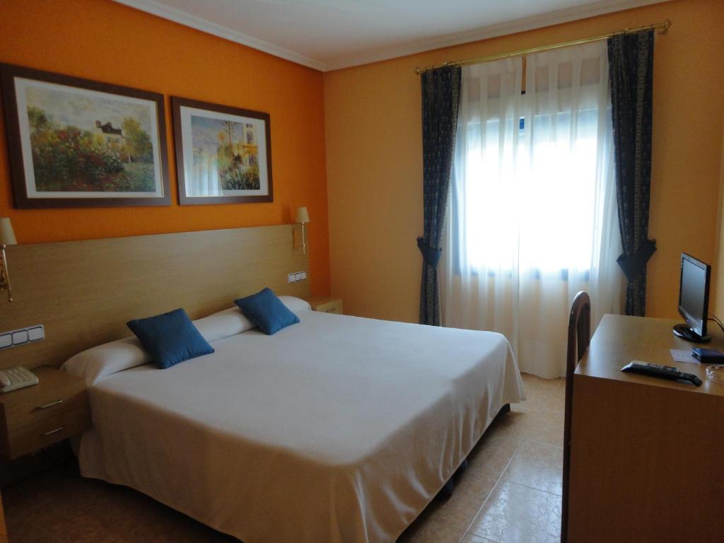 Postel nebo postele na pokoji v ubytování Hotel Mirador