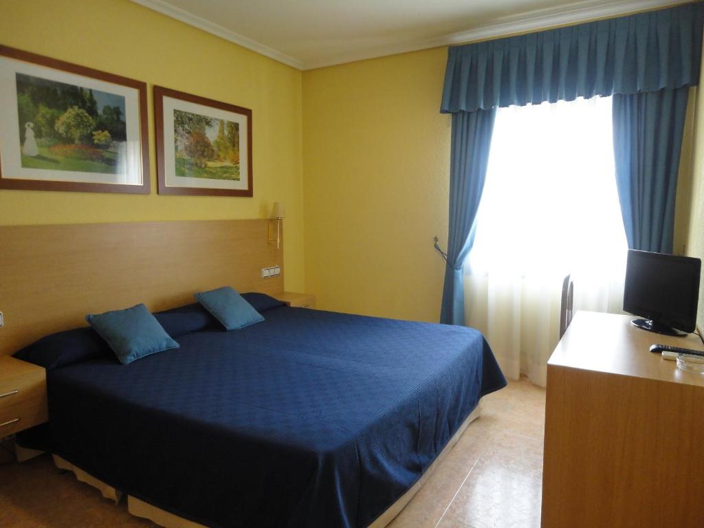 Postel nebo postele na pokoji v ubytování Hotel Mirador