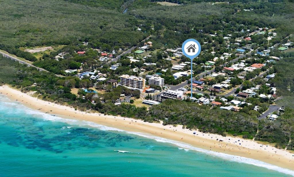 an aerial view of a beach and the ocean at Mudjimba Esp Villa-Beachfront-Pet friendly in Mudjimba