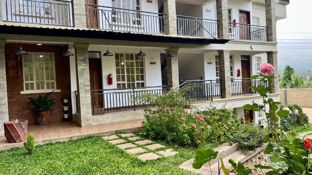 a house with a garden in front of it at Iwandaa Apartments in Nkoanrua
