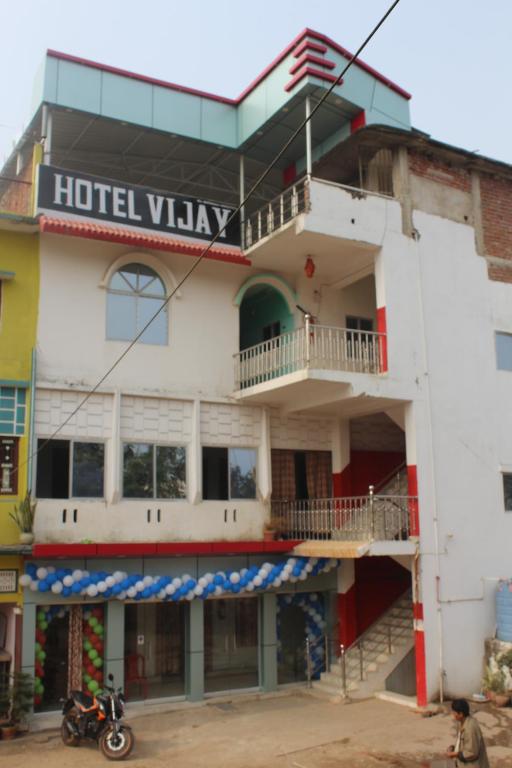 a hotel view with a motorcycle parked in front of it at Hotel Vijay in Rājgīr