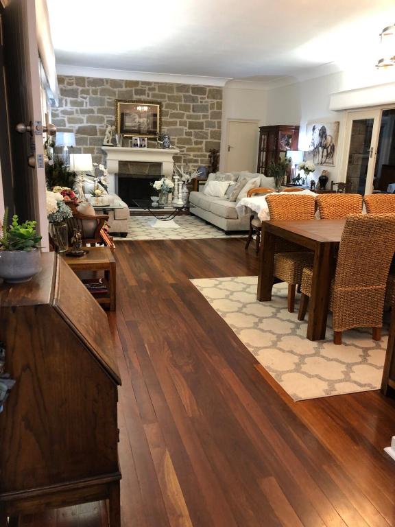 a living room with a table and a couch at Hills Manor House in Greenmount