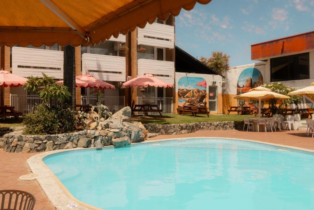a large swimming pool in front of a hotel at Indian Ocean Hotel in Perth