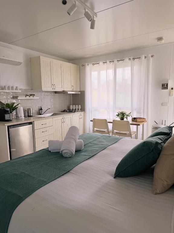 a large bed with two pillows on it in a kitchen at Hickey Vale Farm Studio in Broadford