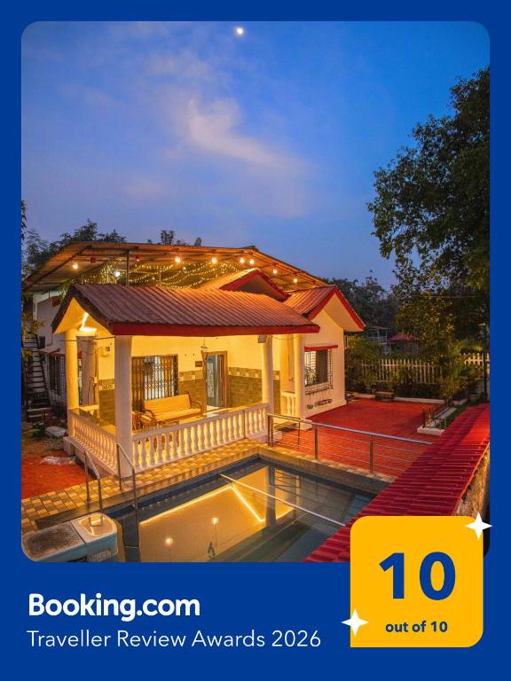a house with a swimming pool in front of it at Mount Aurora I Staymist in Karjat