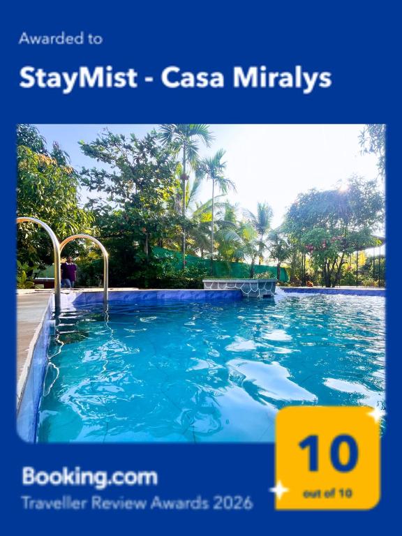 a picture of a swimming pool with the words stay must casas miracles at StayMist - Casa Miralys in Nagaon