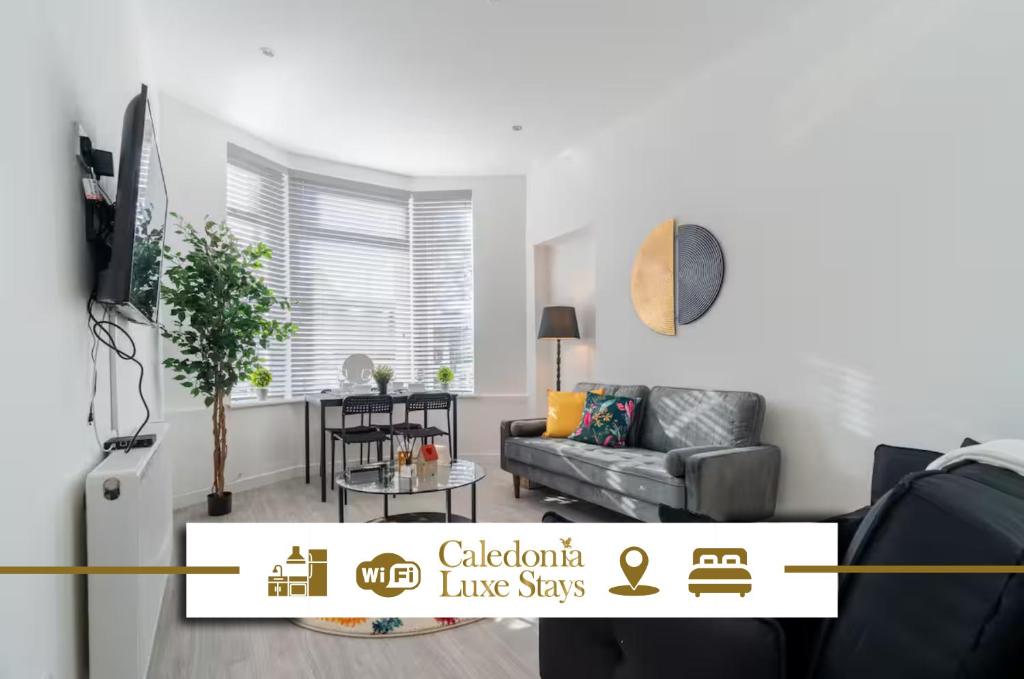 a living room with a couch and a table at Dyke Apartment in Bailleston