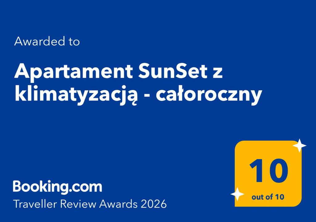 a yellow sign with the words appointment sunset zkimmigrazaaza calotechnology at Apartament SunSet z klimatyzacją - całoroczny in Jantar