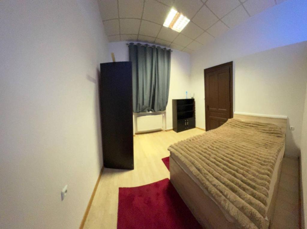 En eller flere senge i et værelse på Apartmán KORUNKA