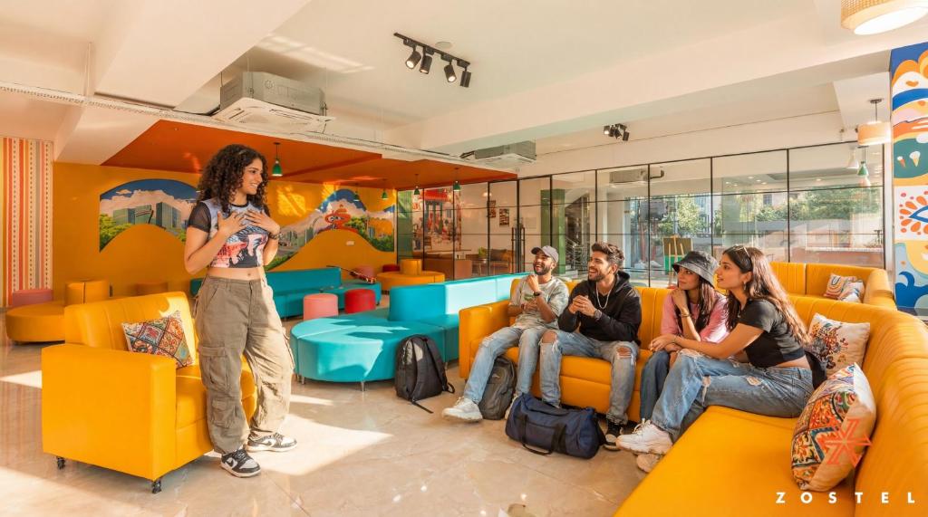 a group of people sitting in a waiting room at Zostel Noida in Noida