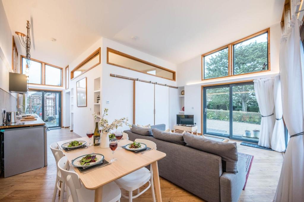 a living room with a table and a couch at The Orchard Annexe, Framlingham in Framlingham