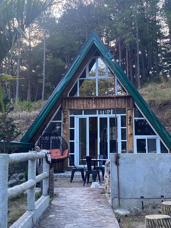 a small house with a thatched roof at Bilza A-House in Sagada