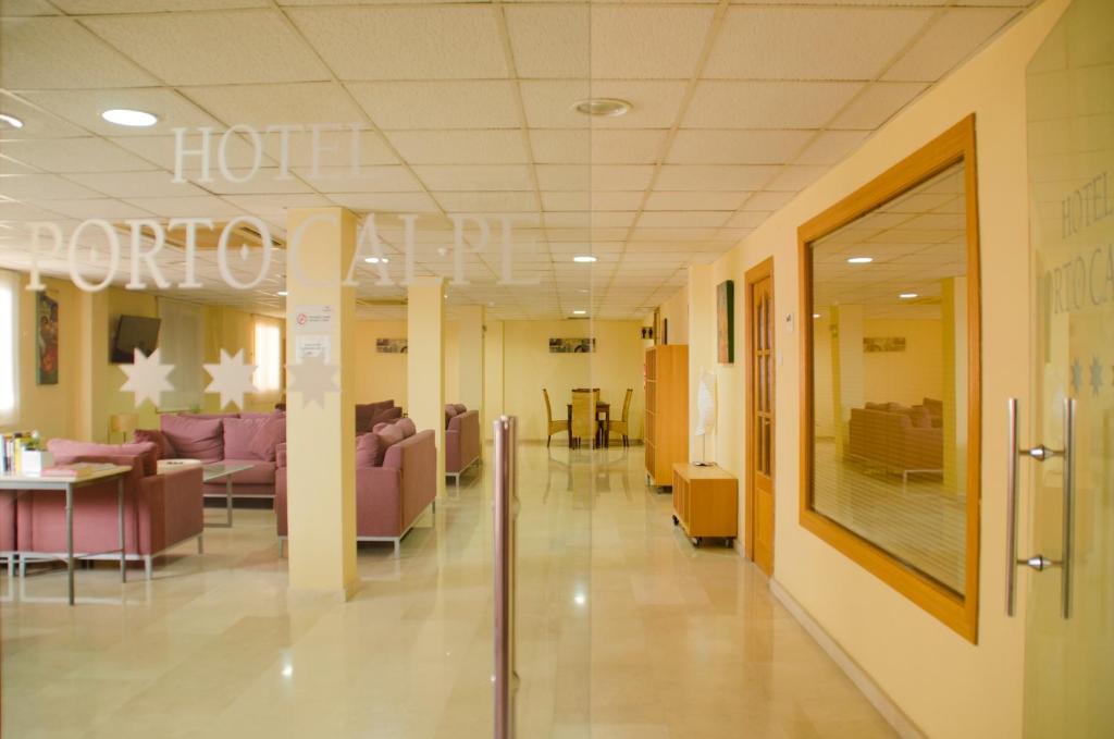 a hospital hallway with couches and a waiting room at Hotel Porto Calpe in Calpe