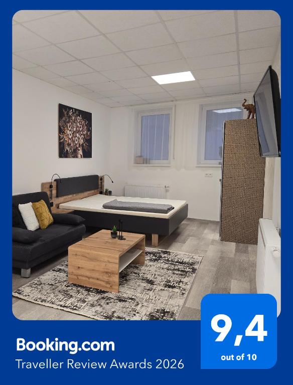 a living room with a couch and a table at Offbase Lodging No9 in Ramstein-Miesenbach