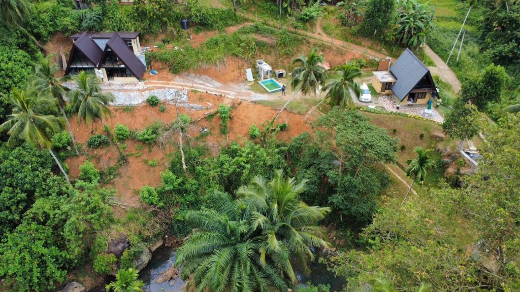 an aerial view of a house in the jungle at RMC Cabana in Udamulla