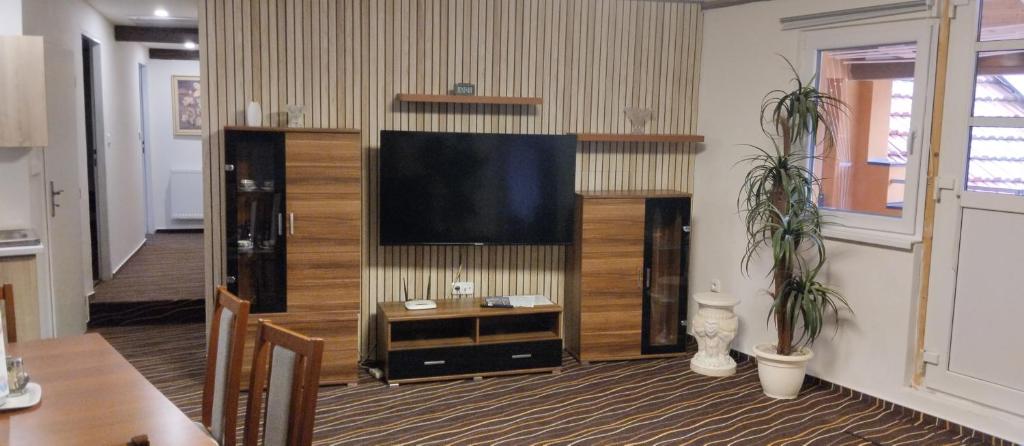a living room with a large flat screen tv at Pension u Veverků in Protivanov