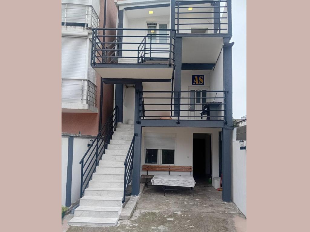 an outside view of a building with stairs at AS MONTENEGRO SUITES in Podgorica