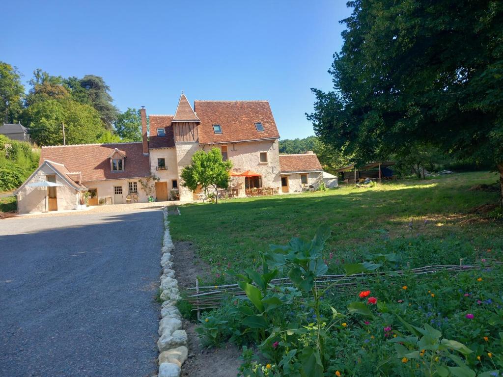 a large house with a road in front of it at La source de Vaugadeland in Nazelles