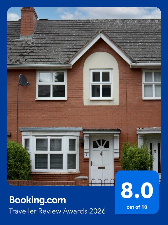 a red brick house with a white door at House number 12 sleeps up to 4 with Smart TVs in every room in Wellington