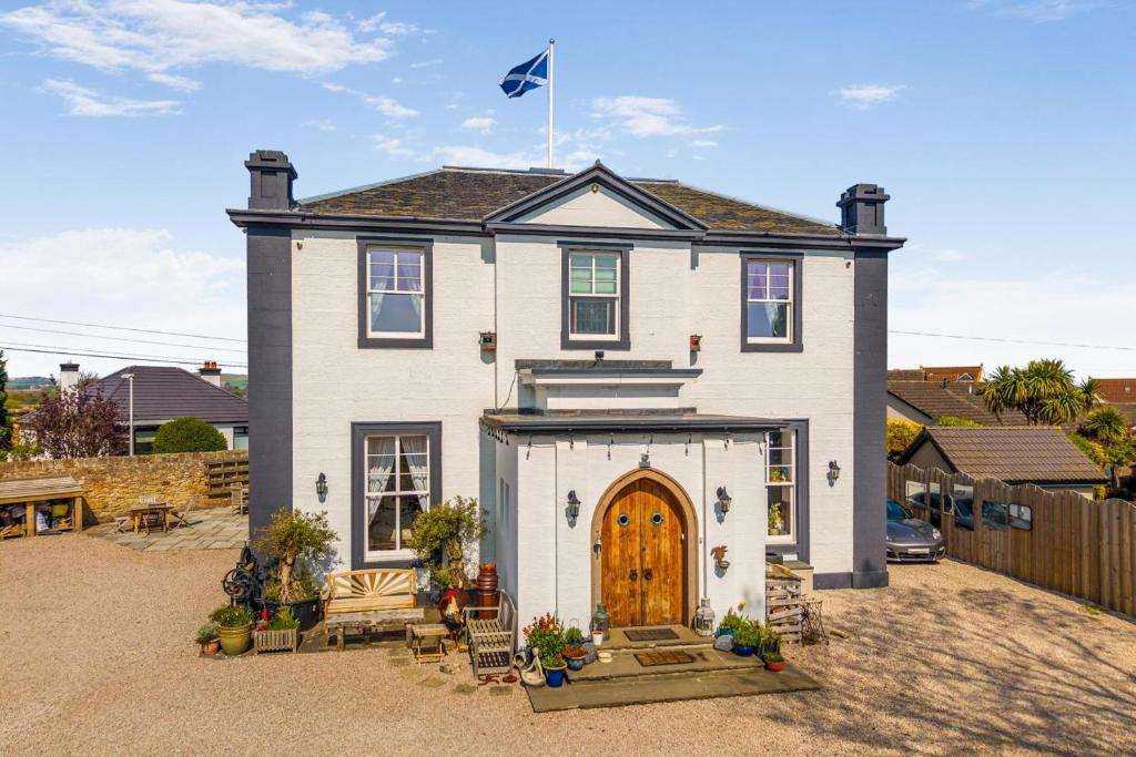 a house with a flag on top of it at 4 Bed in Pittenweem oc-t35090 in Pittenweem