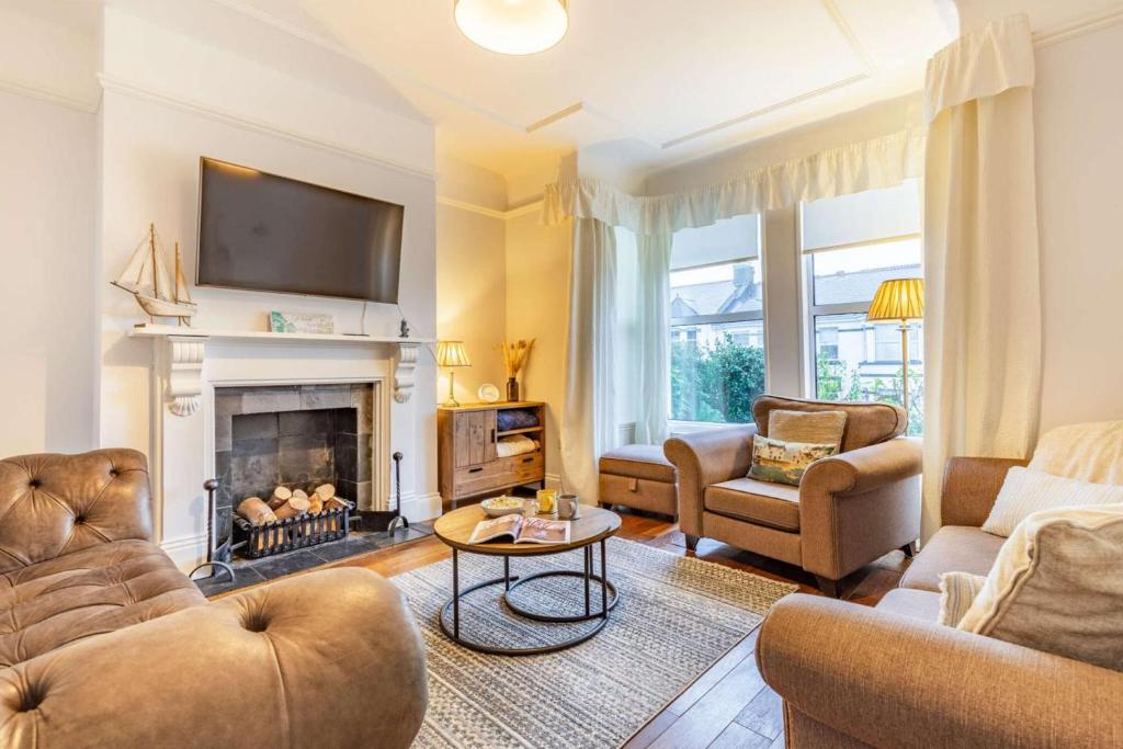 a living room filled with furniture and a fireplace at 4 Bed in St. Austell oc-t32965 in St Austell