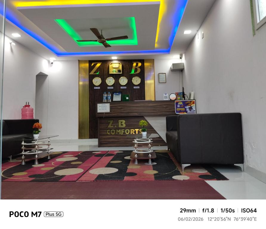 a lobby with a waiting room with a bar at Hotel ZB comforts MYSORE in Mysore