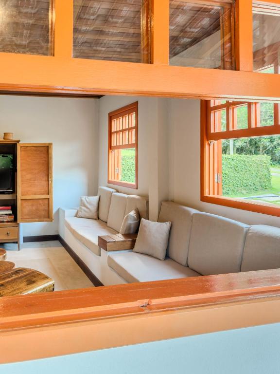 a living room with a couch and a tv at Casarão in Marechal Floriano