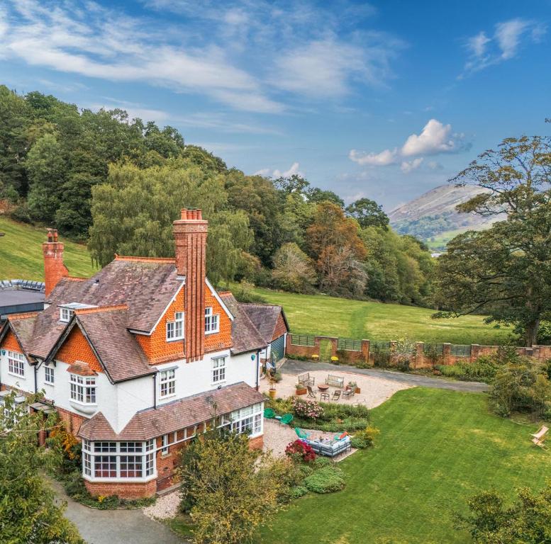 an aerial view of a house with a yard at 5 Bed in Church Stretton oc-t30413 in Church Stretton