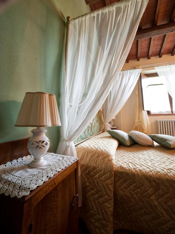 Posteľ alebo postele v izbe v ubytovaní Agriturismo Podere il Corniolino