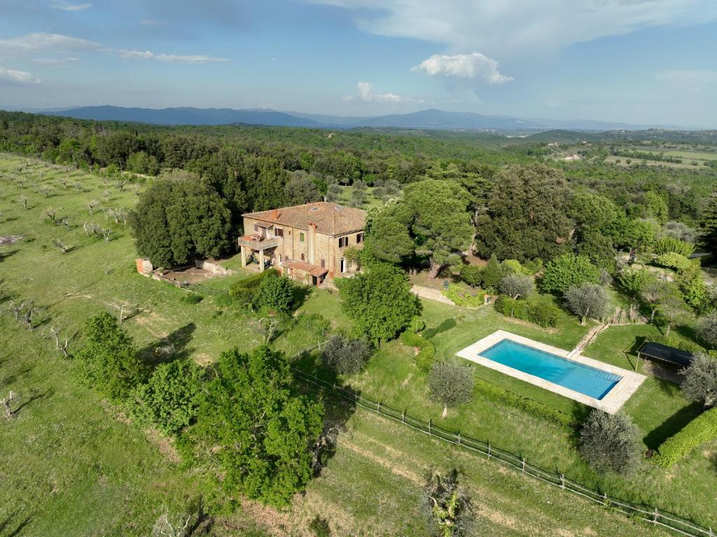 an aerial view of an estate with a swimming pool at Tuscan Farmhouses at Castello del Calcione Estate in Lucignano