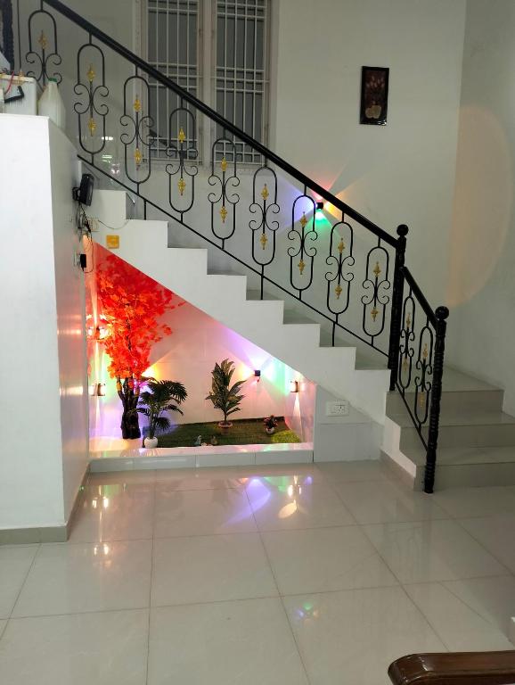 a staircase in a house with lights on it at CRUZ Palace in Jāmb
