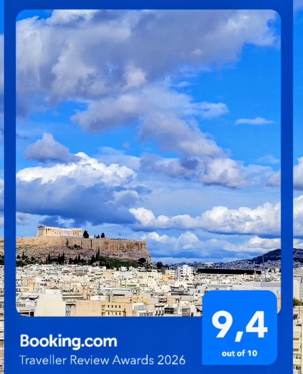 a view ofhens from the acropolis under a blue sky at Athens Pearl in Athens