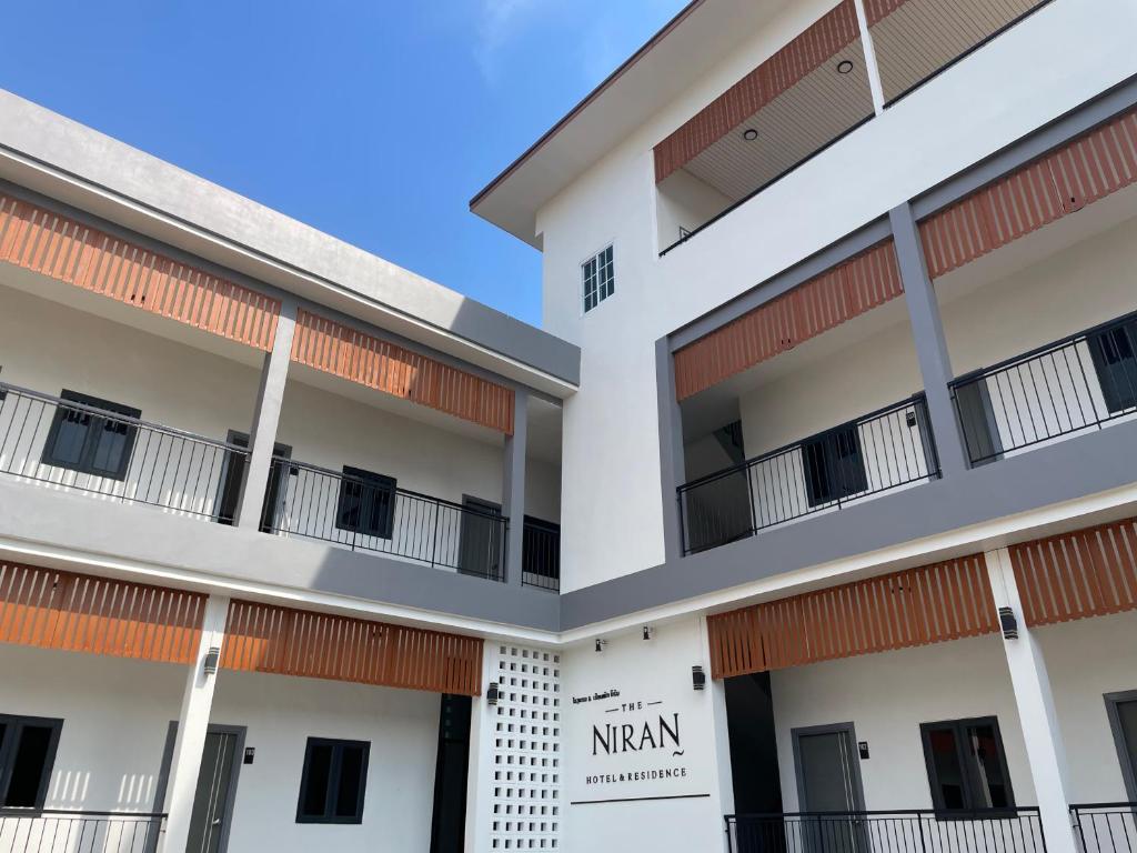 a view of the exterior of a building at NIRAN Hotel & Residence in Ban Talai