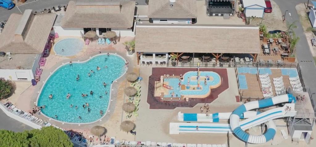 an overhead view of a pool at a resort at Maïana Resort in La Grande Motte