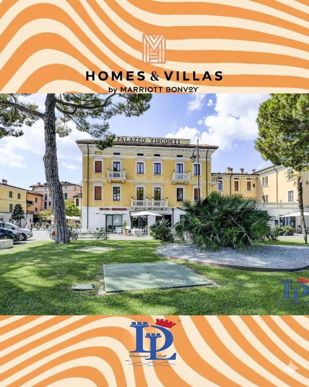 a picture of a building with the words homes and villas at Palazzo Visconti Luxury Suite DesenzanoLoft Official Partner Homes & Villas by Marriott Bonvoy in Desenzano del Garda