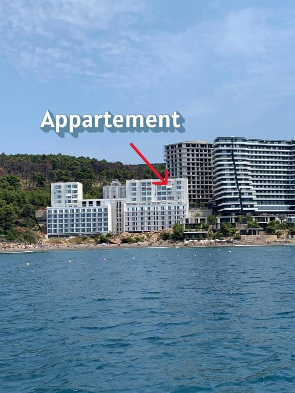 a city with a red arrow that says agreement at Ocean View Beach Apartment in Shëngjin
